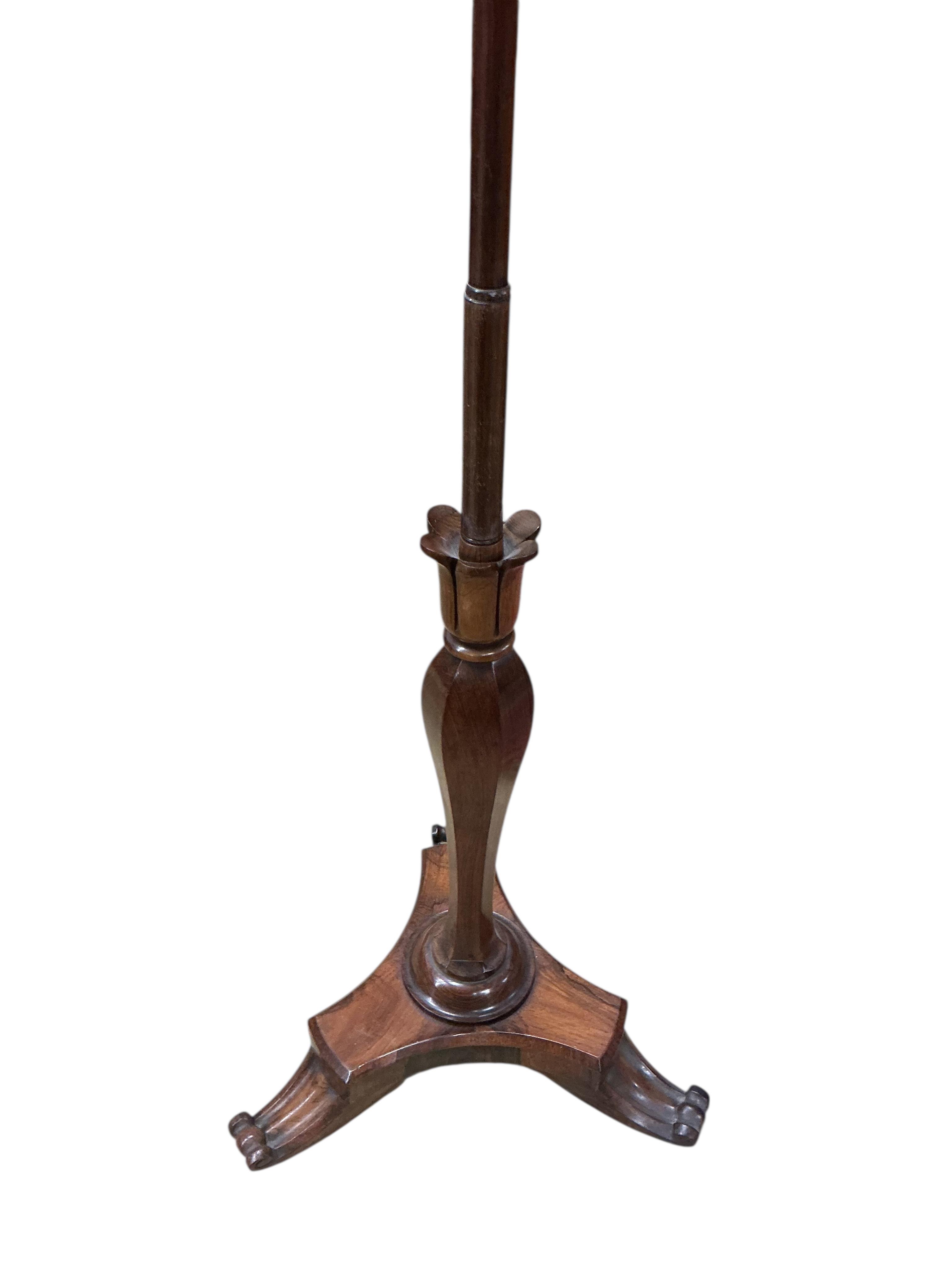 An early Victorian rosewood pole screen with polychrome tapestry banner, height 155cm